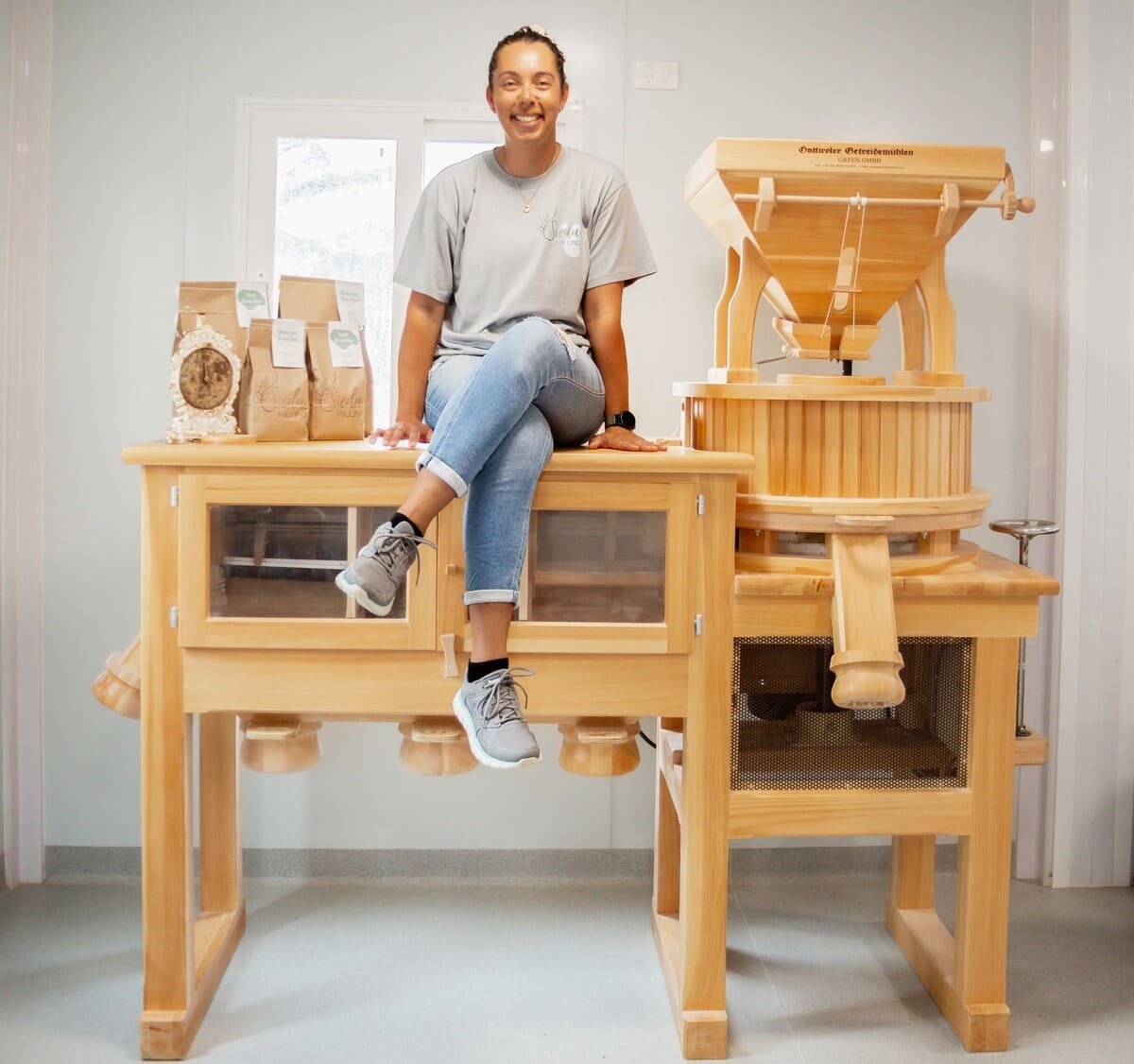 Shiane Lea with her on-farm flour mill, imported from Austria
