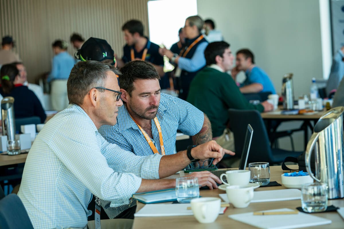 Josh and Rabobank’s Ian Donaldson go through the figures at the Young Farmers Forum
