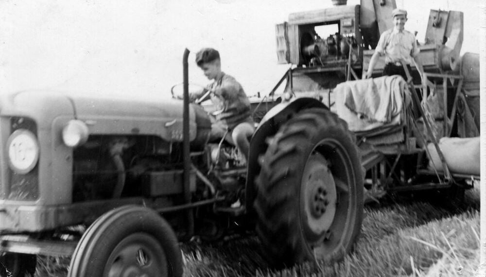 Gerrit on his family farm in the Netherlands in 1958. Last year was the first year he left the harvest to the next generation, after 70 years driving headers.