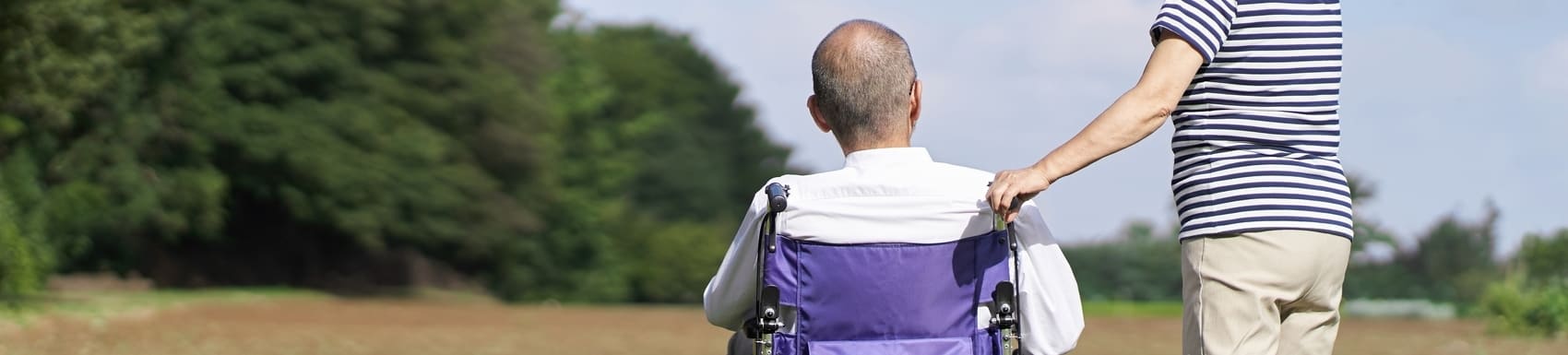 Elderly couple looking at the field